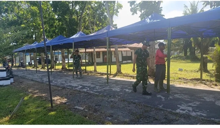 Pemasangan Umbul-Umbul Warnai Persiapan Pembukaan TMMD Reguler Ke 128